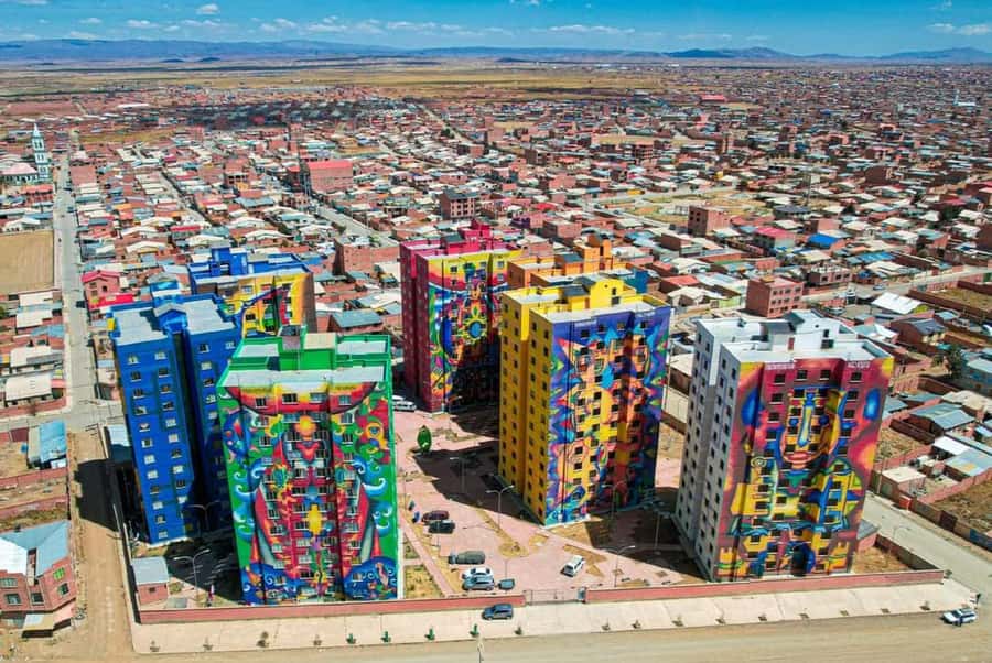 From La Paz: El Alto and Cholets Guided Day Trip - Entering two colorful cholet homes