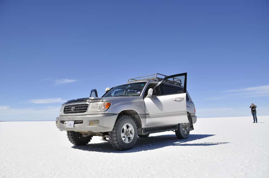 From La Paz: Uyuni Salt Flats & Lagoons 5-Day Tour - Flamingos and red volcanic scenery on day two
