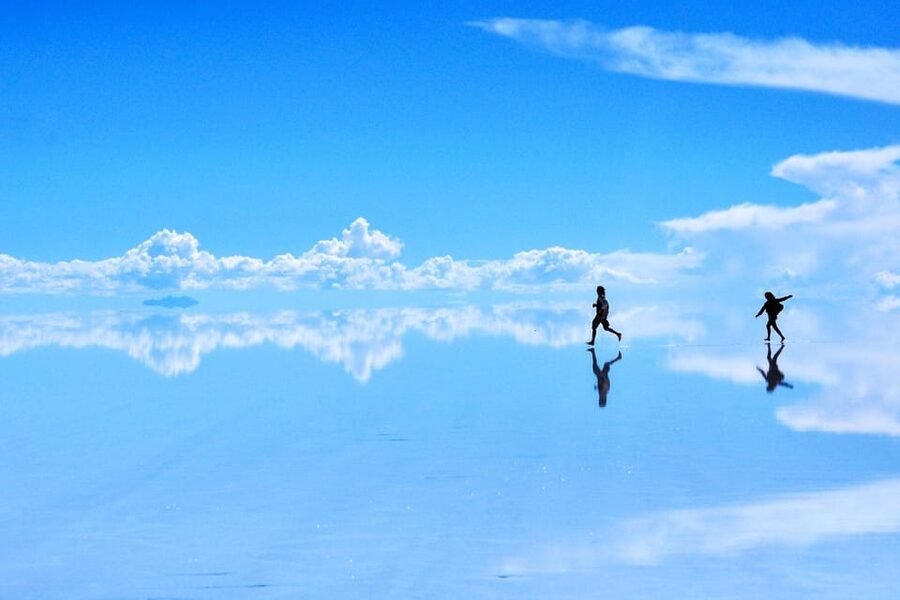 Uyuni: Classic Uyuni Salt Flats Tour + Hotel Pickup - Sunset, wine, and the long ride back